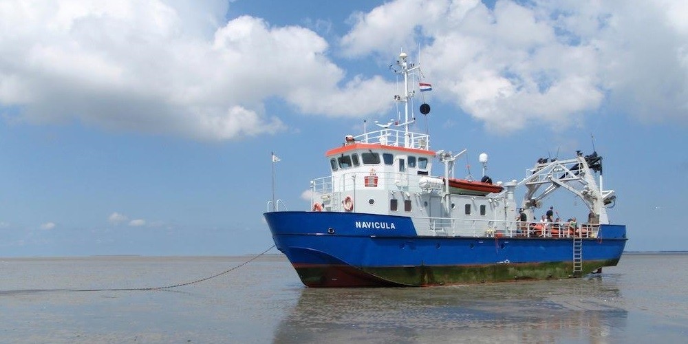 The RV Navicula during the SIBES project mission on the Wadden Sea.
