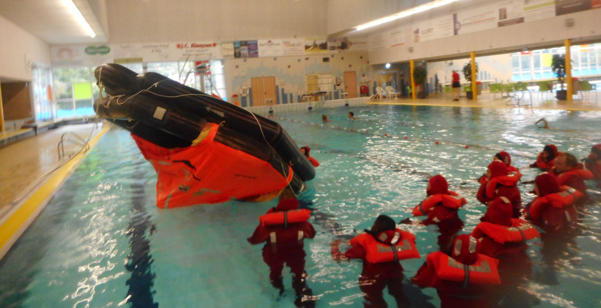 We get instructions on how to flip a life raft in the water
