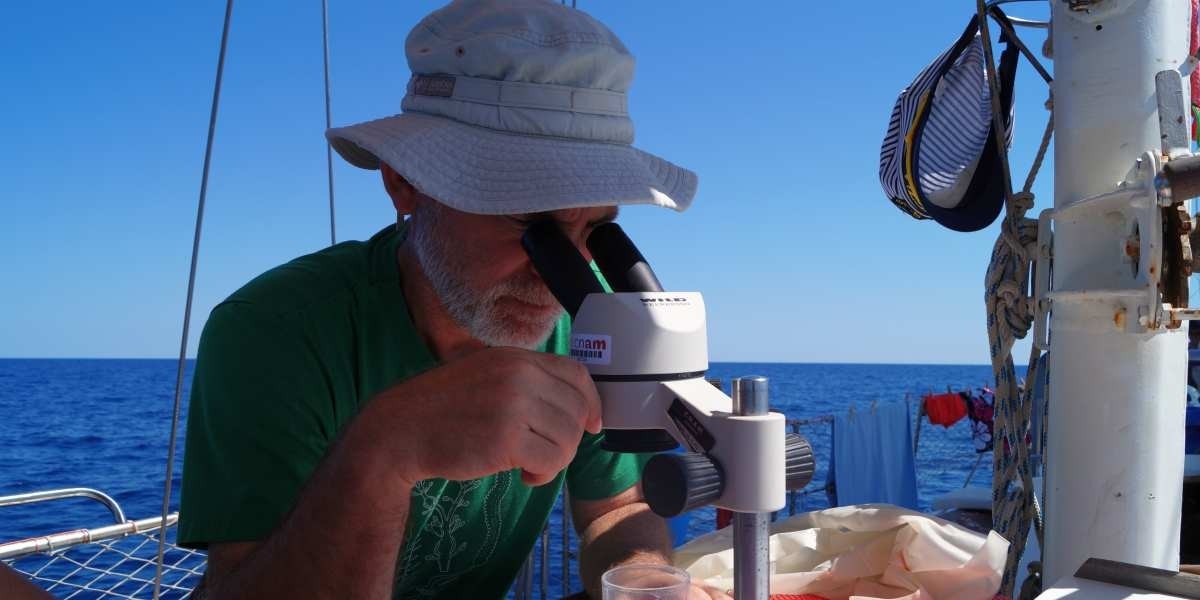 Erik checking plastic marine debris during summer 2017 ExpeditionMed cruise aboard sailing research vessel Ainez.
