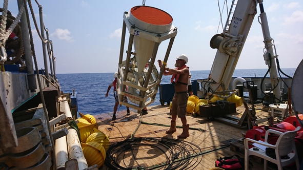 The recovered sediment trap is hoisted on deck