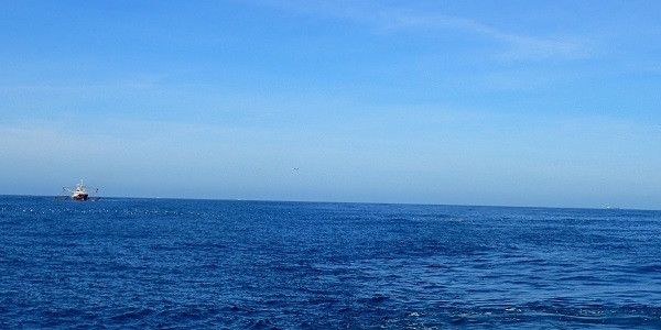 The fishing vessel and buoy marking the TUD lander in one shot