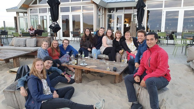 The Marine Masters Summer Course students relaxing at the beach and watching the sunset after working on the group projects during the day.