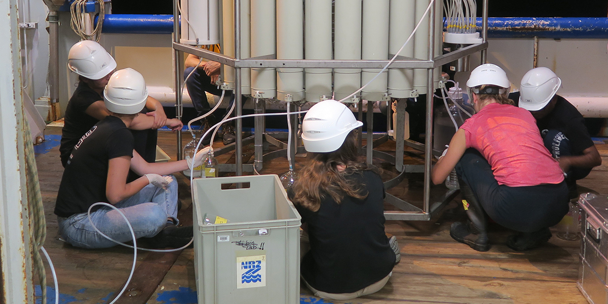 Scientific crew of the Black Sea 2018 cruise sampling Black Sea anoxic water from the Niskin bottles.