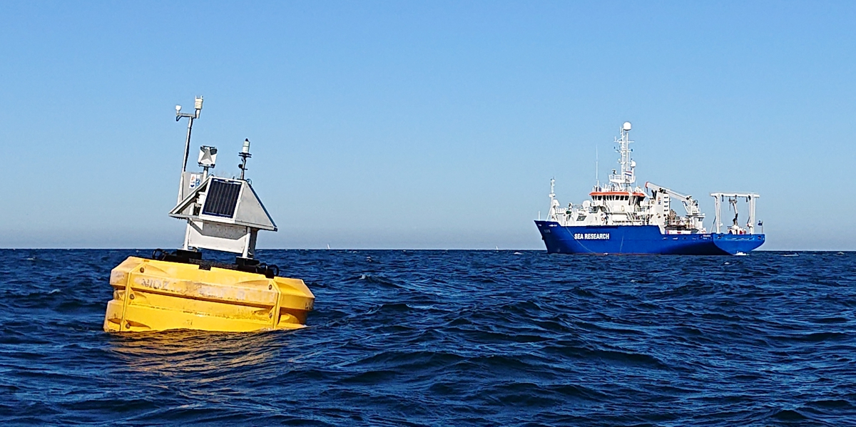 One of the dust-collecting buoys that monitors Saharan dust in the eastern Atlantic. In the background RV Pelagia