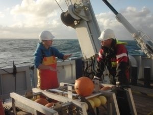 Karin explains to the crew how the camera system works. 