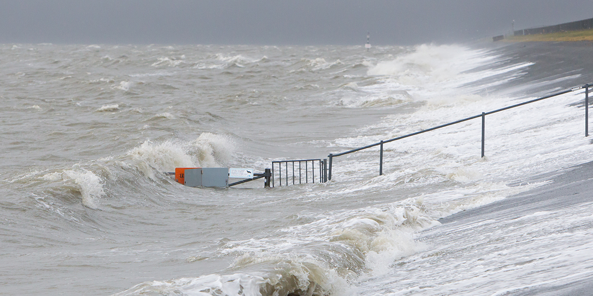 Lauwersoog, The Netherlands - 6 December 2013: Extreme high tide at the dikes of the dutch coastal works, danger of flooding of a small harbour. Mylmages – Micha/Shutterstock.com