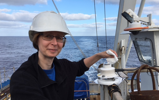 Dr. Anu Heikkilä measuring UV light intensity on board the R/V Pelagia.