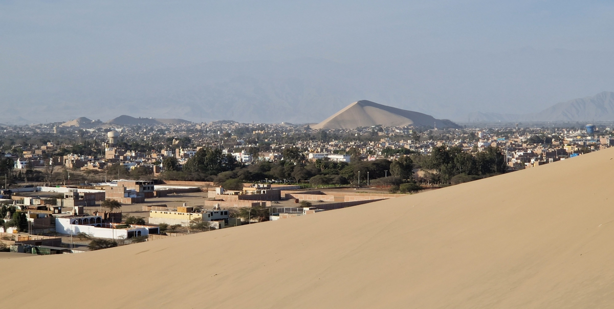 View over the city of Ica with in the distance yet another huge sand dune
