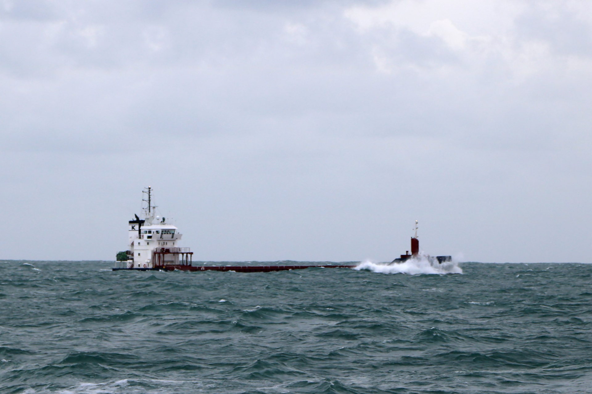 A tanker behind a wave crest fighting against the heavy sea (don’t worry, it’s not sinking) , photo: NIOZ