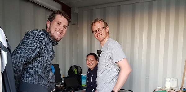   Johan, Karin, and Leo in the container on the aft deck where the side scan sonar data is recorded, getting ready for the evening's work