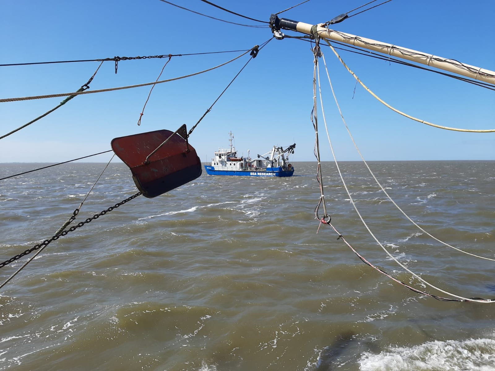 A view from the outside; meeting other researchers on the Wadden Sea (picture by Bram Couperus from Wageningen Marine Research, aboard the TX21)