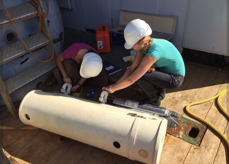 PhD students Szabina Karancz and Siham de Goeyse along with the Pelagia crew are preparing sensor-laden moorings, which we will deploy in two different sinkholes for about 6 days to collect a suite of high-resolution measurements. Photo: Matthew Humphreys