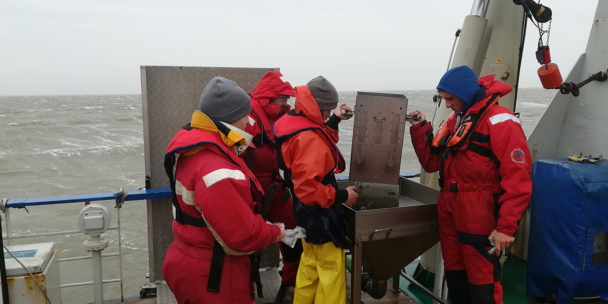 Collecting samples with the RV Navicula under bad weather conditions. Photo: Sander Holthuisen