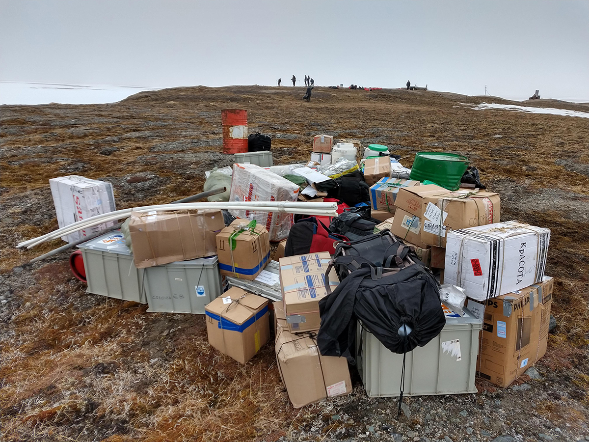 6 June 2019 Approximately 2,000 kg of luggage containing provisions and research material. In the background the team is pitching the tent camp.