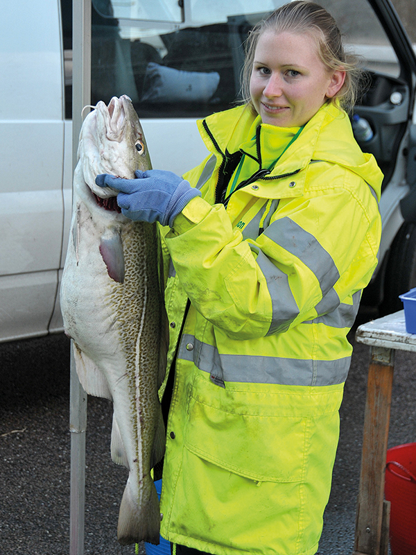 Rowena Henderson with a large Cod caught at Sizewell on the Suffolk coast. Photo: Robin Somes