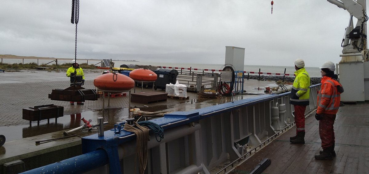 The dust-buoy weight is being hoisted on board