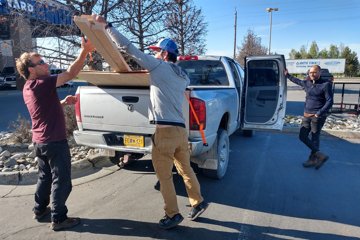 Loading the truck (left: Job ten Horn, middle: Jim Johnson, right: Jeroen Reneerkens) with preparation materials. Photo: Jan van Gils.