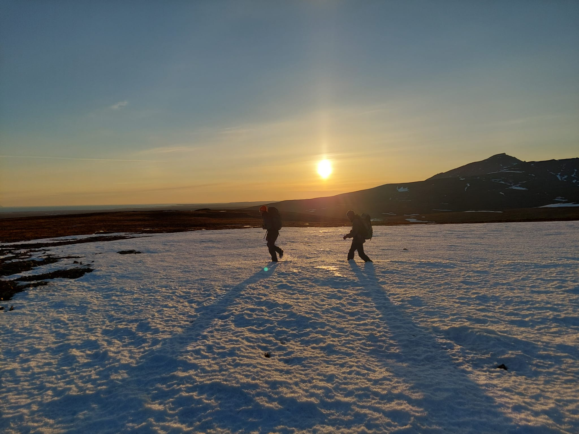 :  Jan and Jeroen walking through the last snow patch. Photo: Tim Oortwijn