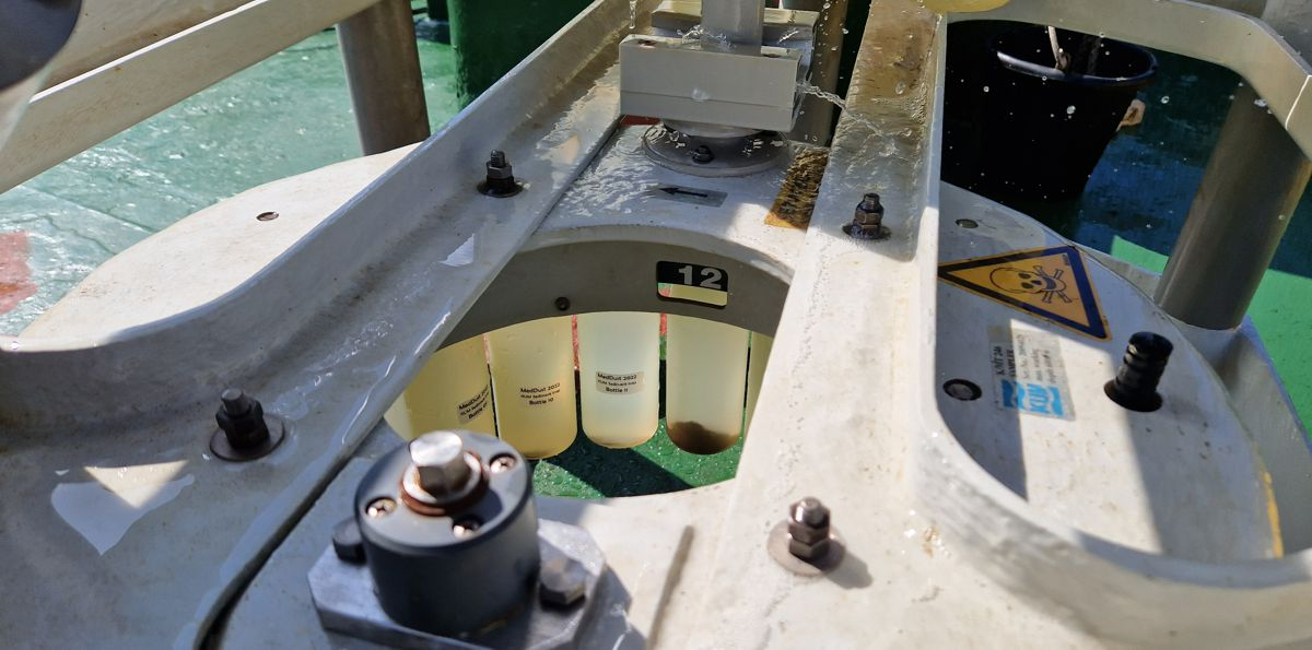 Close-up view on the sediment-trap carrousel with the bottles containing some material collected over a time period of 10 days.