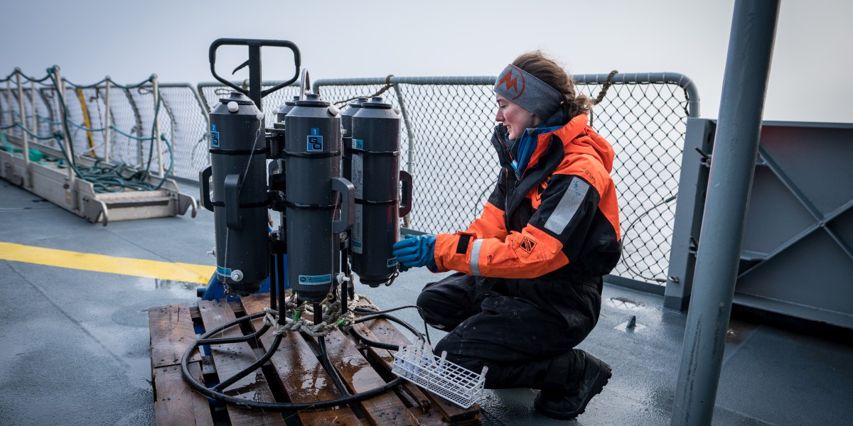 Alice Stuart Lee taking sea water samples from a rosette sampler.