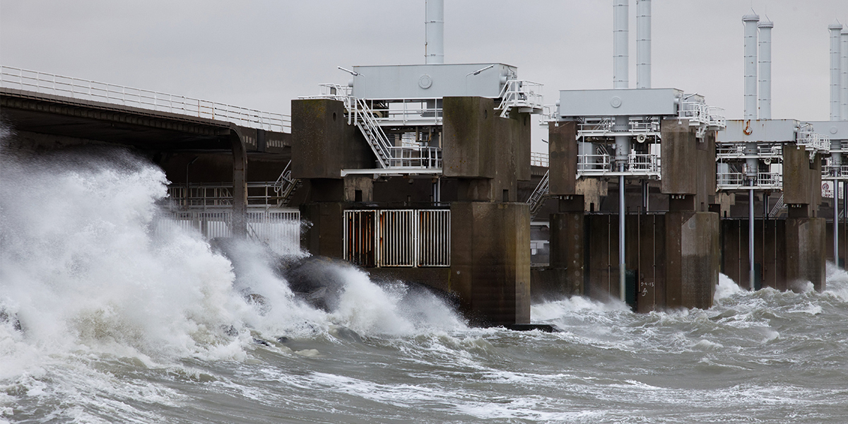 Oosterscheldekering storm surge barrier closed to protect Sealand against high tide, Breedfoto/Shutterstock.com
