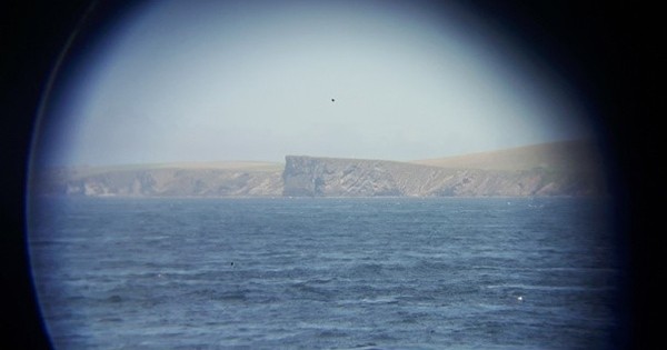 Picture of Scottish island through binoculars.