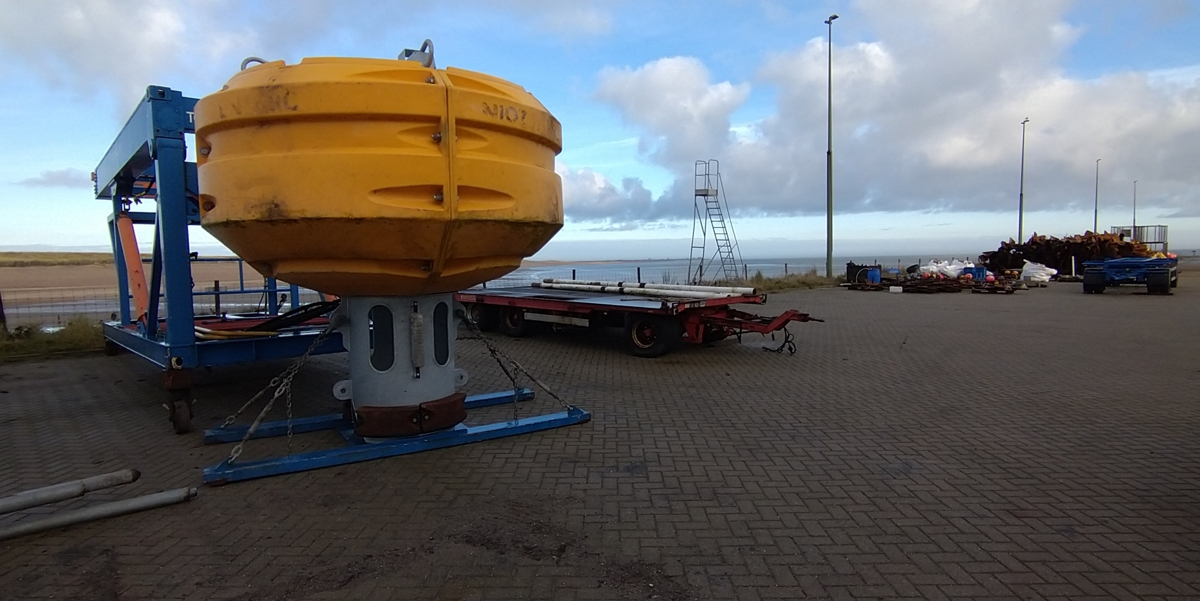 Spare buoy with freshly galvanized tube waiting on the quay of the NIOZ harbour