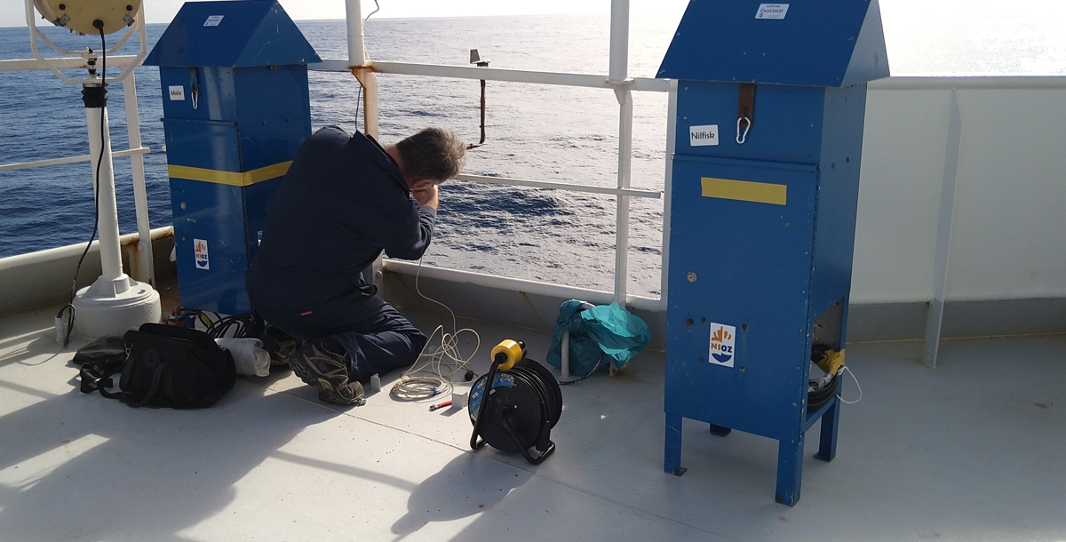 NIOZ technician Bob Koster installing dust collectors on the highest deck of RV Pelagia