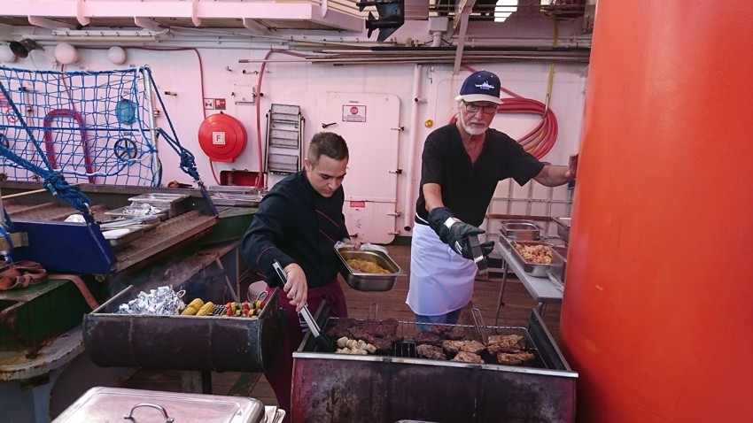 Cook Patrick (left) and Michael for once cook on deck