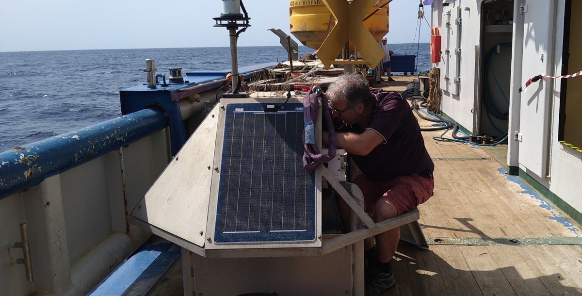 NIOZ technician Bob climbs into the buoy's mast to service it