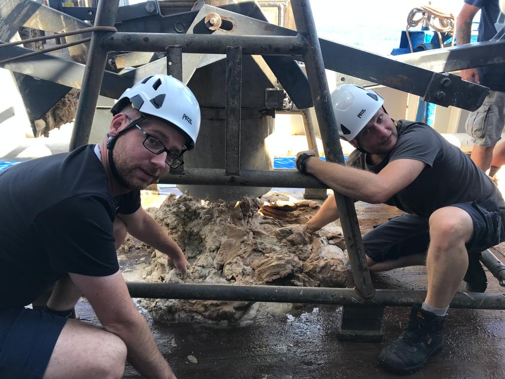 Earth scientists playing in the mud to recover serpentinite clasts. In picture: Oliver Plümper and Peter Kraal