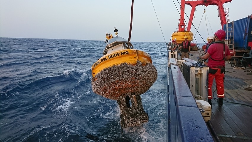 Dust-collecting buoy Carmen is being hoisted out of the water