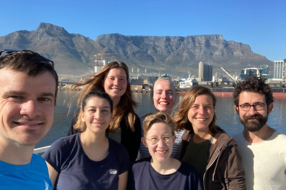 A selfie of the expedition’s seven scientists with Table Mountain and part of Cape Town in the background. Photo: Matthew Humphreys