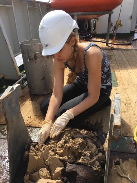 PhD student Szabina Karancz taking samples from the sediment of the bottom of the gas leeking sinkhole. Photo: NIOz