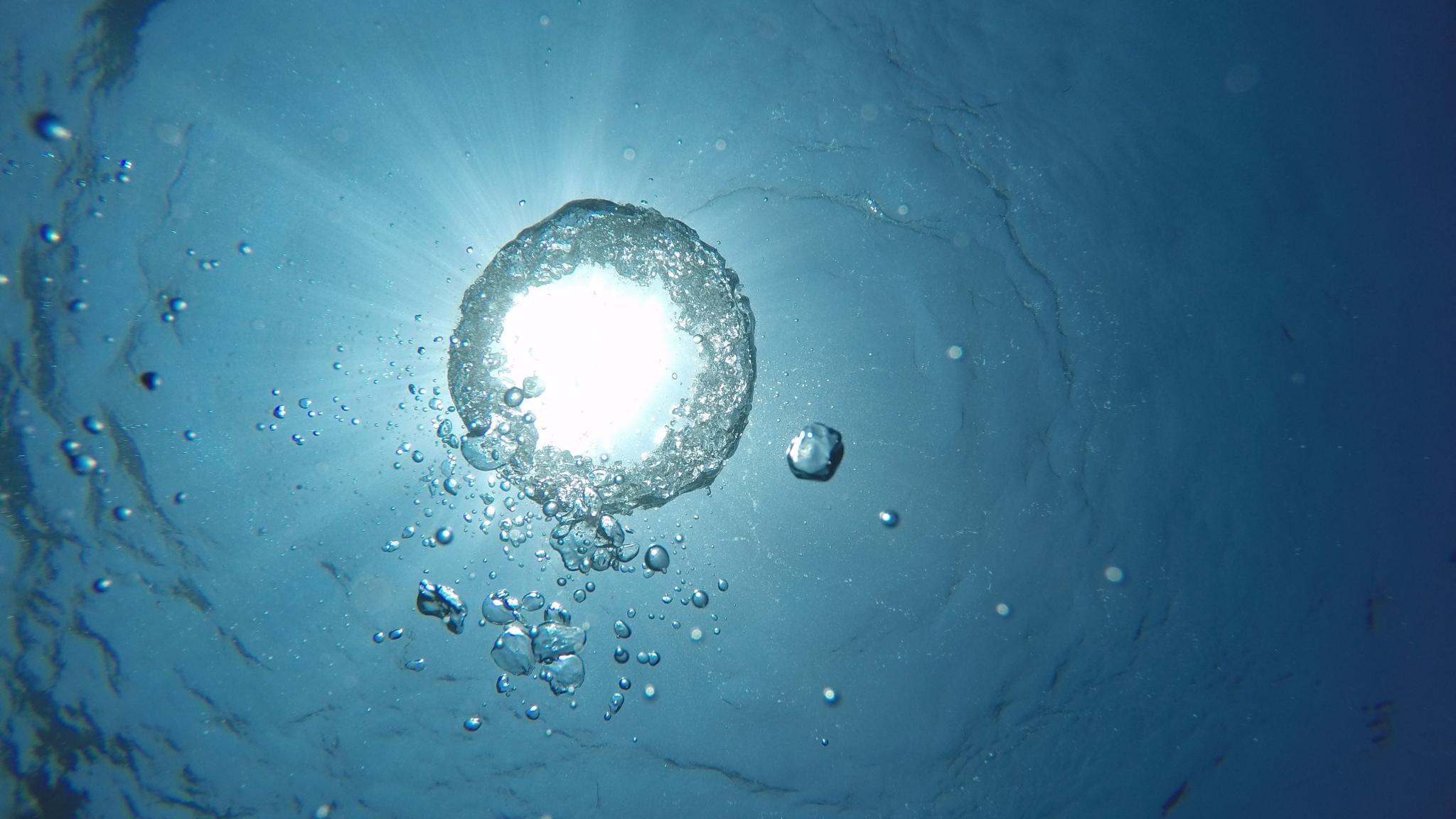 An air bubble in the ocean seen from below