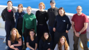 A group of young scientist are posing for a photo