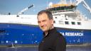 Helge Niemann in front of the research vessel.