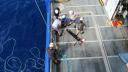 view from above of five people working on deck of a research vessel