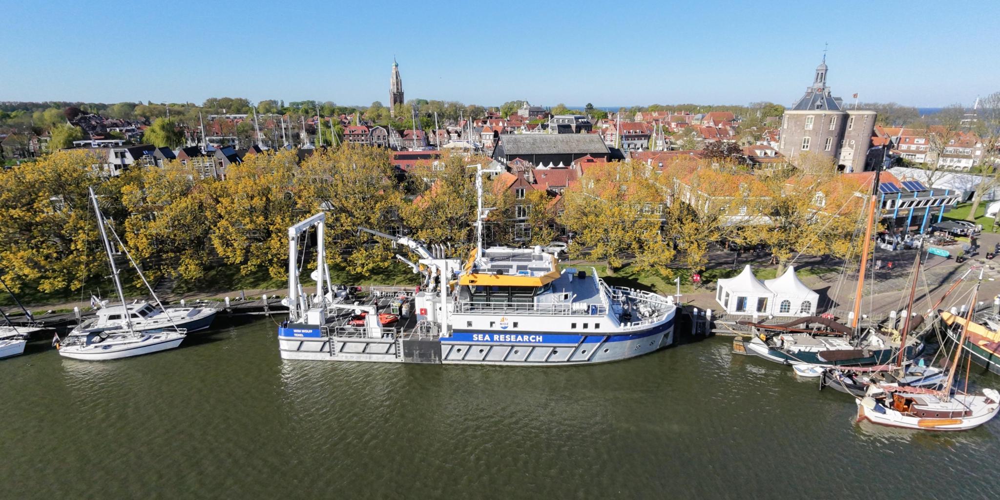 The ship RV Wim Wolff at a quay, surrounded by normal sailing boats.