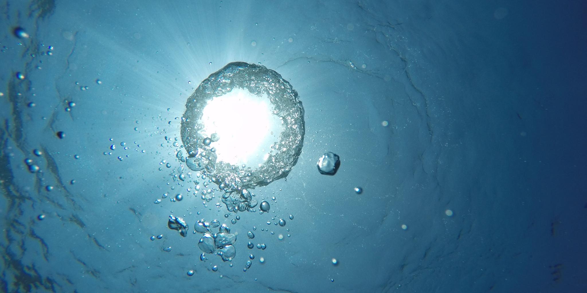 An air bubble in the ocean seen from below