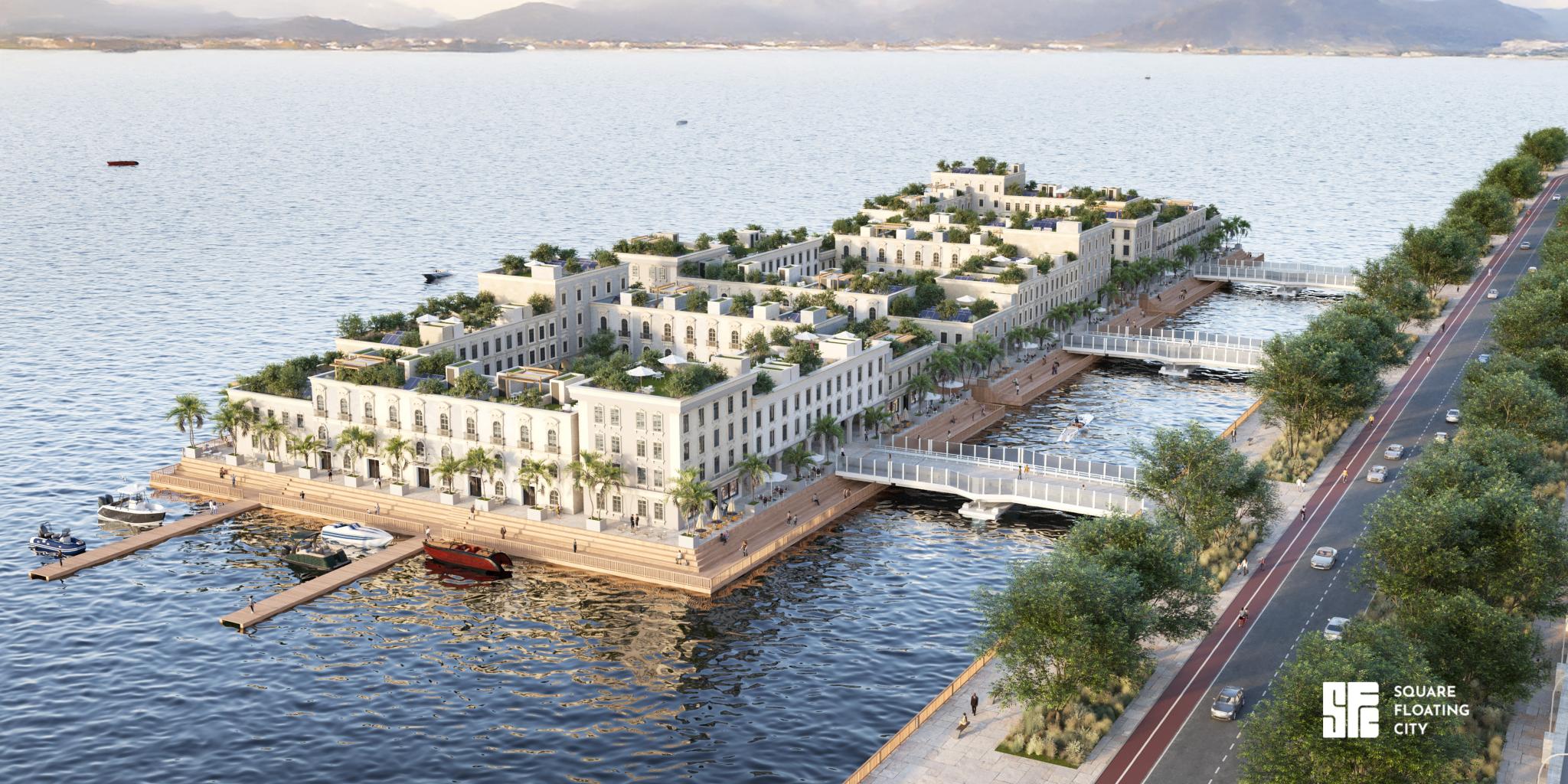 An artist impression of a 'floating city': an island in a river with on it four square apartment buildings with gardens, streets and people. It's connected to the shore with three bridges.