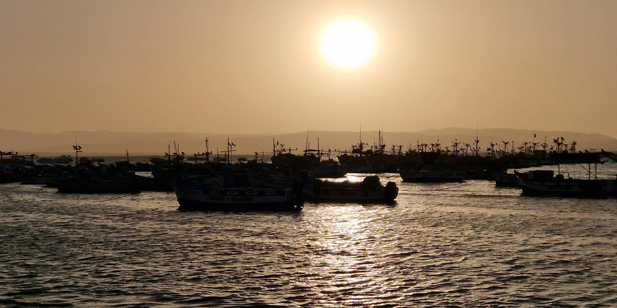 sunset and sea, orange sky because of dust