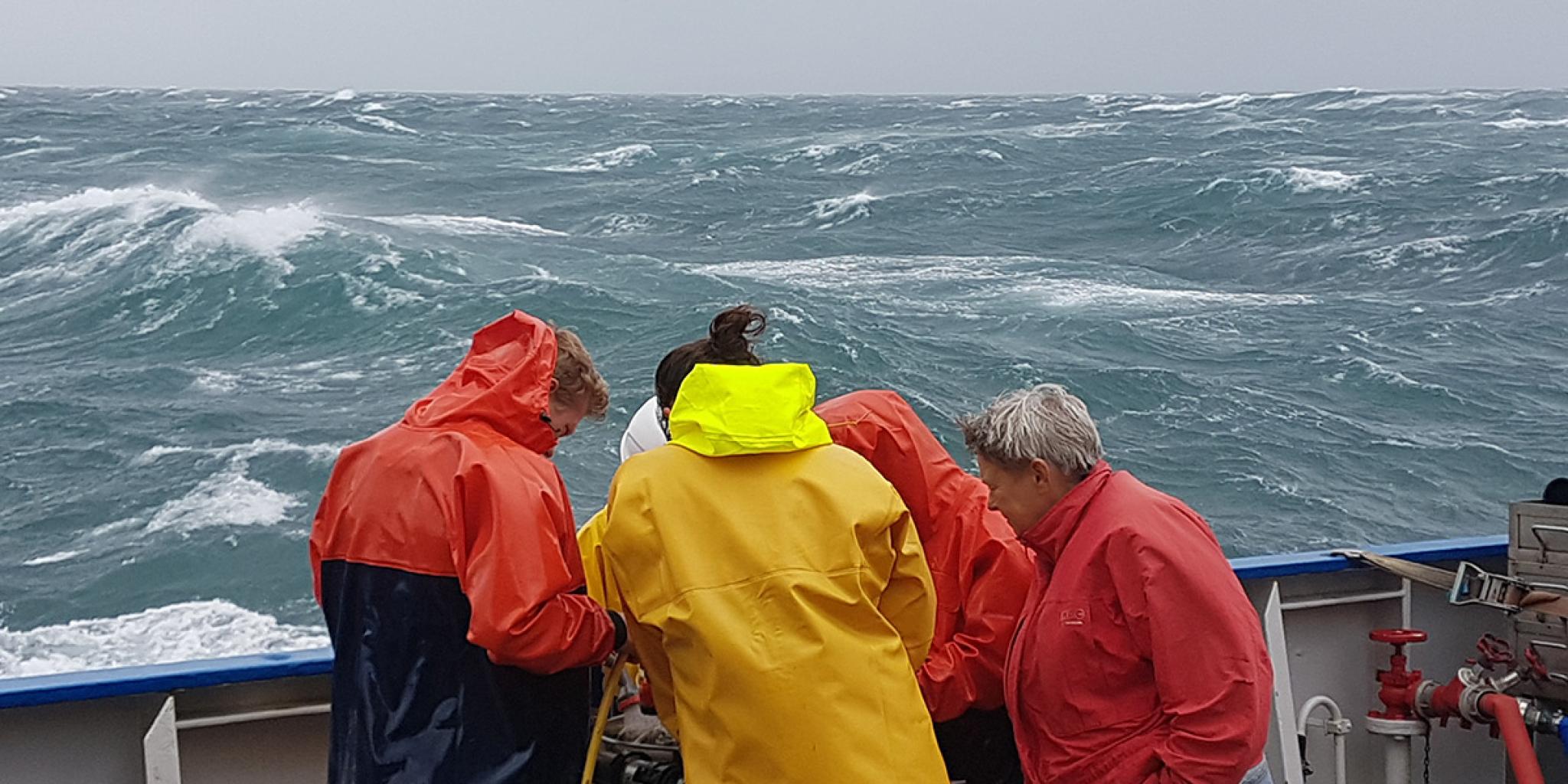 The crew of RV Pelagia working to get the equipment out, before the storm hits (image: Justin Tiano/NIOZ)
