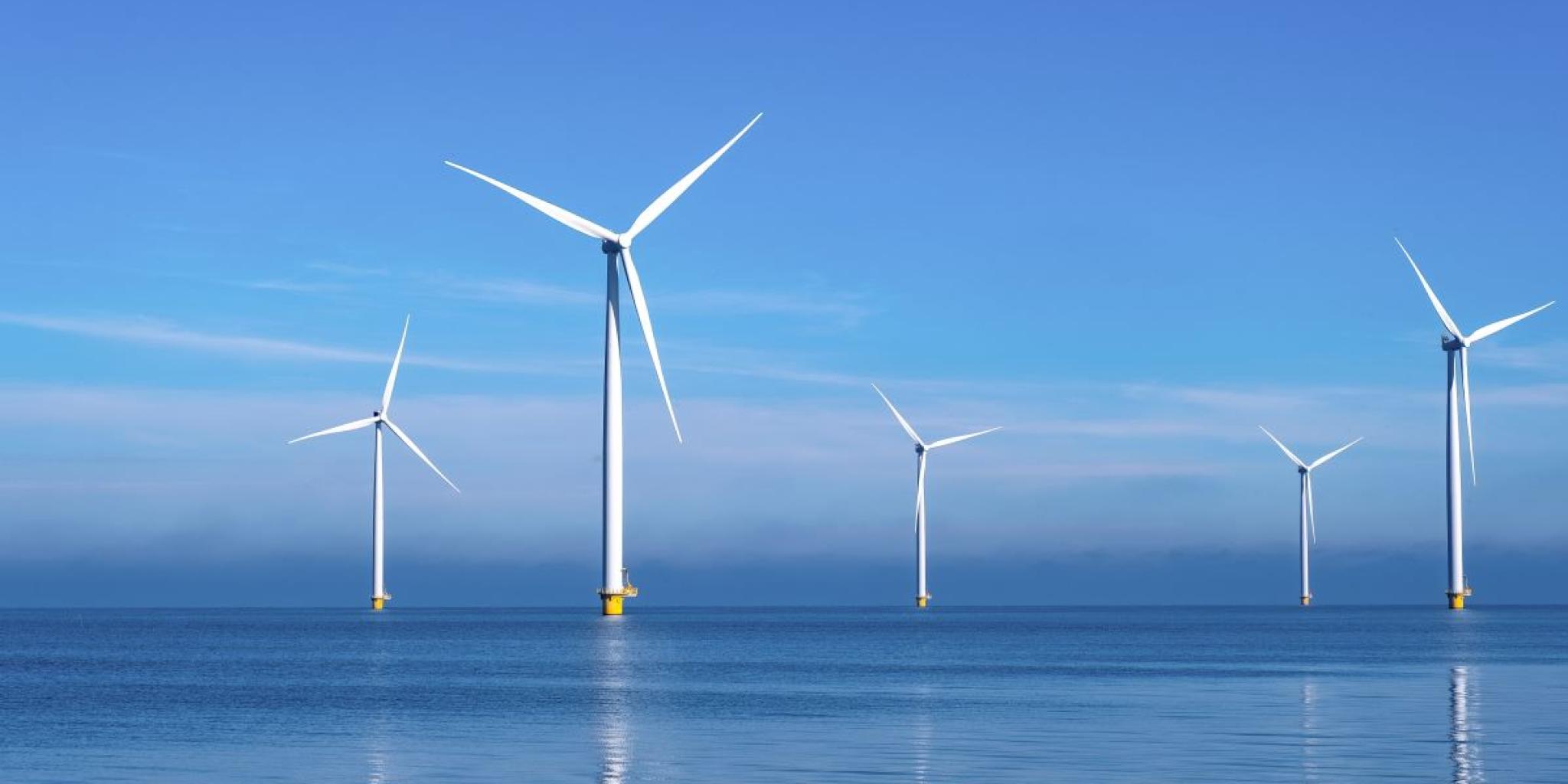 Windmills in a quiet blue sea