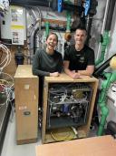 Installing an underway system to measure surface ocean and atmospheric CO2 concentrations.