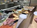The daily "Cheese Thirty" snack platter with cheeses, cured meats, crackers and fruit served on board.