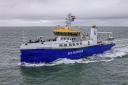 The blue-and-white research vessel Anna Weber-van Bosse sails across the sea.