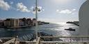 A view over the bow of research vessel Pelagia, showing the quay of Kralendijk, Curaçao.