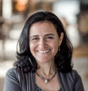 portrait photo of smiling woman with dark hair 